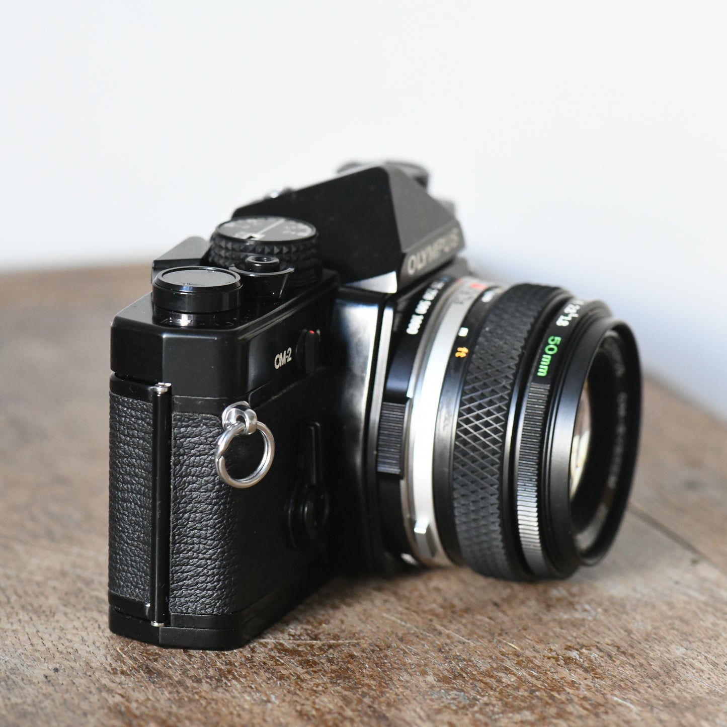 Olympus OM-2 Black 35mm Film SLR Camera + 50mm f/1.8 Lens Kit - New Light Seals